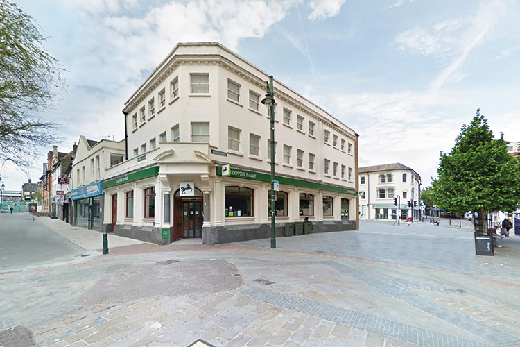 Corner building housing Lloyds Bank in urban environment
